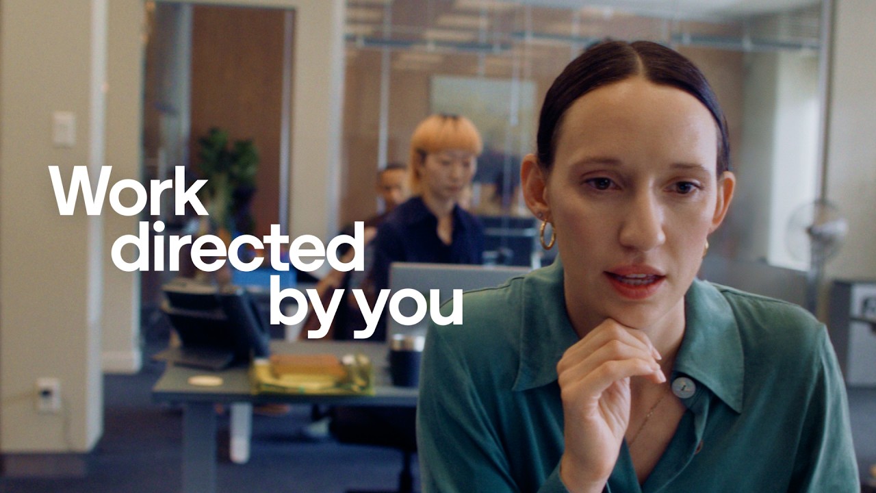 A woman at work with the line Work directed by you in the ChatGPT Work film